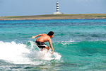 Surfista a Punta Prima Minorca